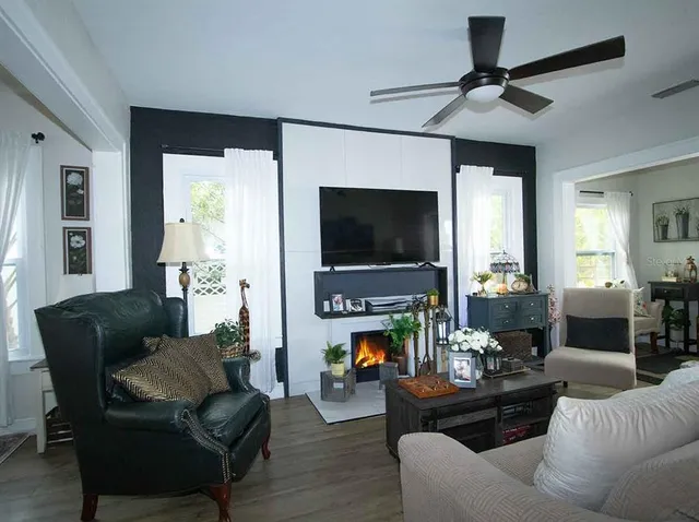 a living room with furniture and a flat screen tv