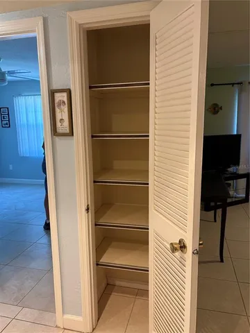 a view of room with air conditioner and windows