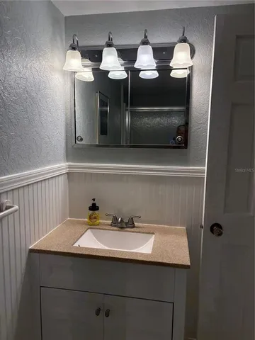 a bathroom with a shower and a toilet