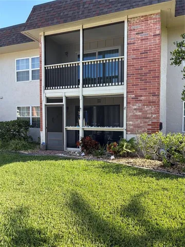 a living room with furniture and a ceiling fan