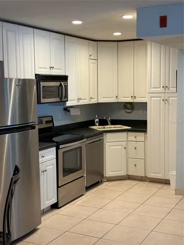 a view of a dining room with furniture and window