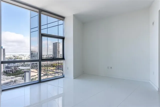 a kitchen with a sink and a mirror