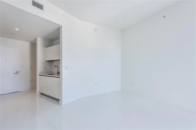 a close view of a sink and utility room with a sink