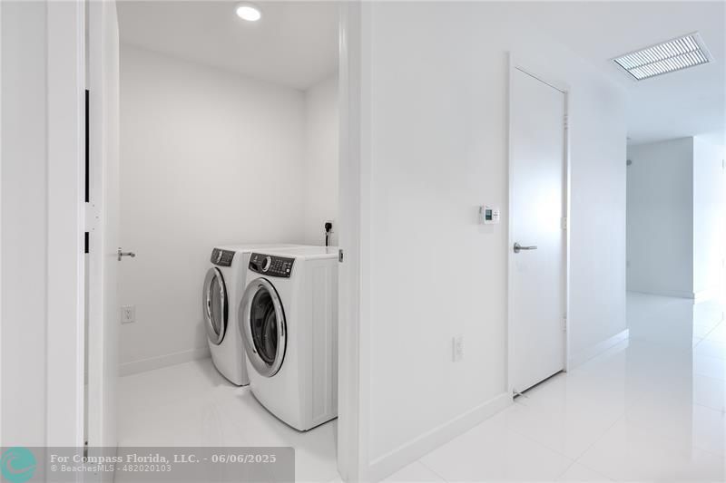 851 Northeast 1st Avenue, Unit 1912 Miami, FL 33132 - Photo 23 of 26 a utility room with dryer and washer