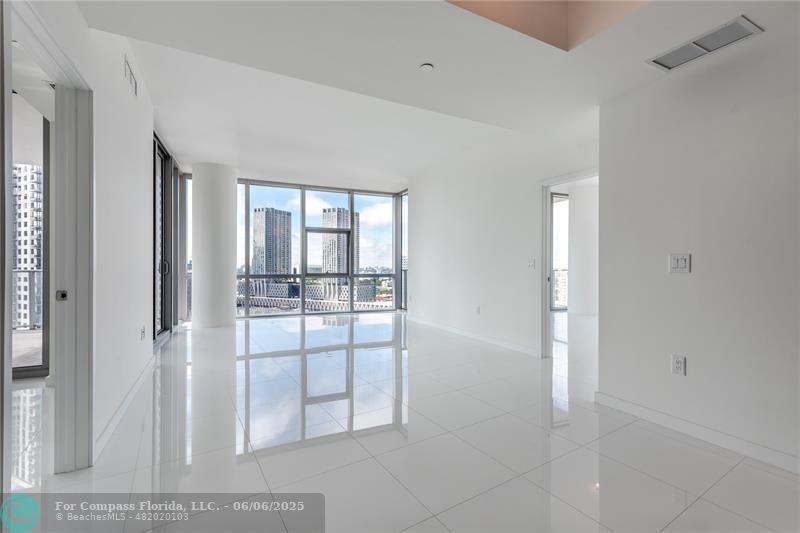 851 Northeast 1st Avenue, Unit 1912 Miami, FL 33132 - Photo 6 of 26 a view of a livingroom and window