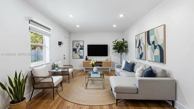 a living room with furniture and a flat screen tv