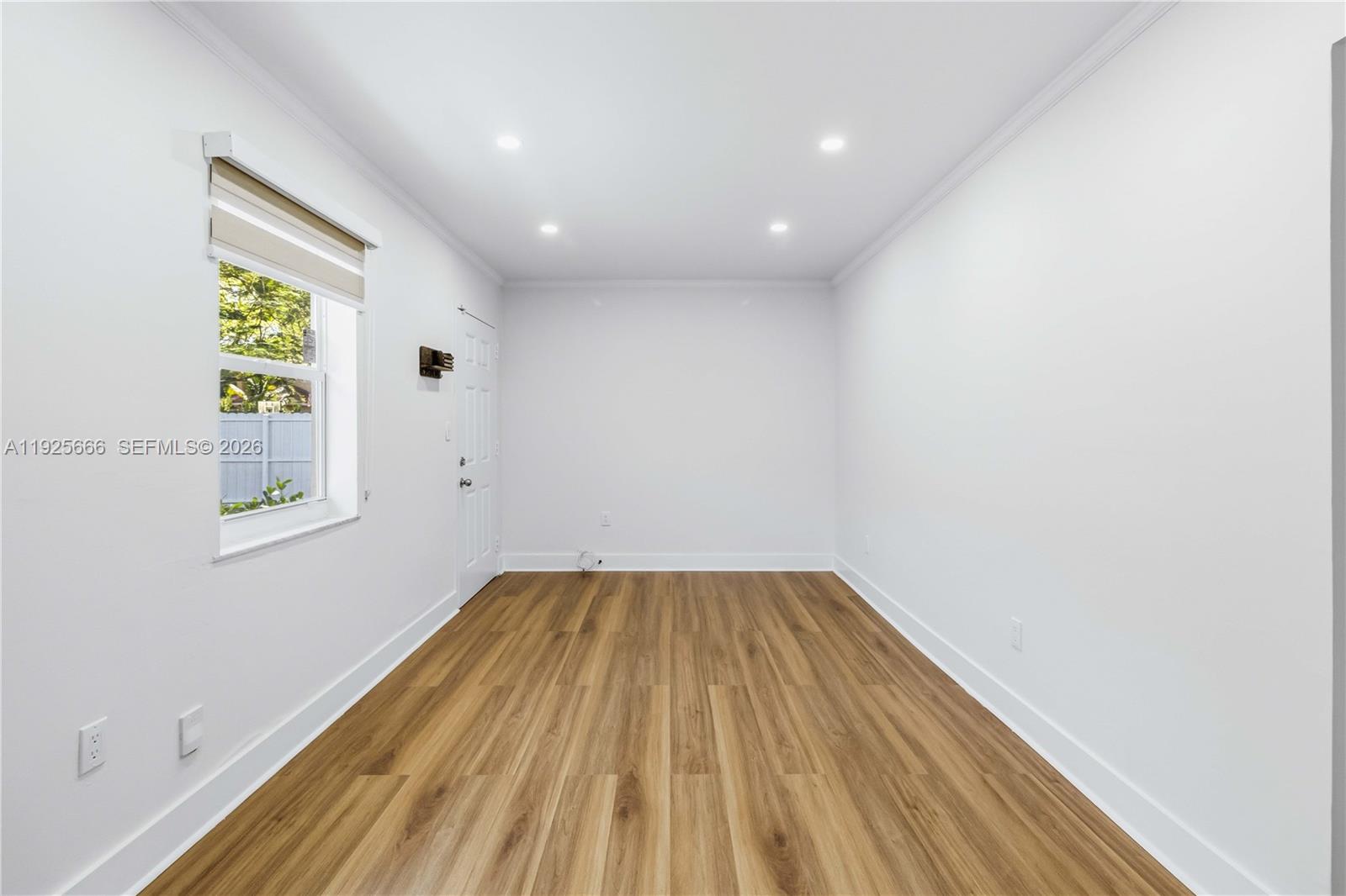 3240 Southwest 69th Avenue, Unit 2 Miami, FL 33155 - Photo 11 of 26 a view of empty room with wooden floor and fan