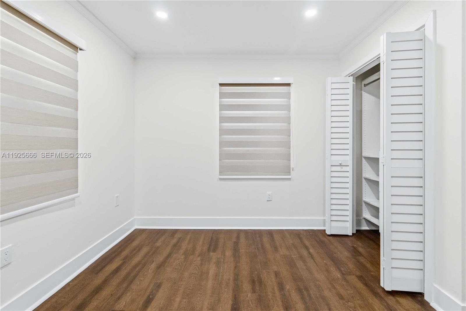 3240 Southwest 69th Avenue, Unit 2 Miami, FL 33155 - Photo 20 of 26 a view of wooden floor and windows in a room