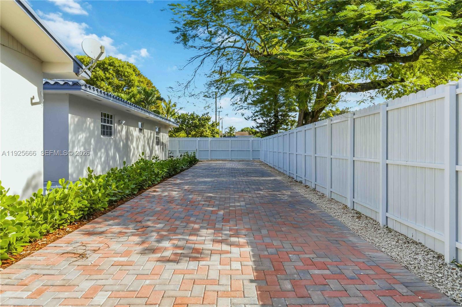 3240 Southwest 69th Avenue, Unit 2 Miami, FL 33155 - Photo 23 of 26 a view of a pathway with a yard