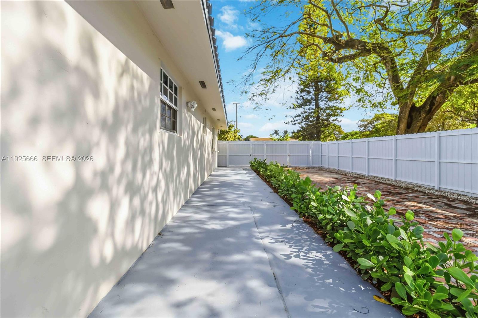 3240 Southwest 69th Avenue, Unit 2 Miami, FL 33155 - Photo 24 of 26 a view of a pathway both side of a yard