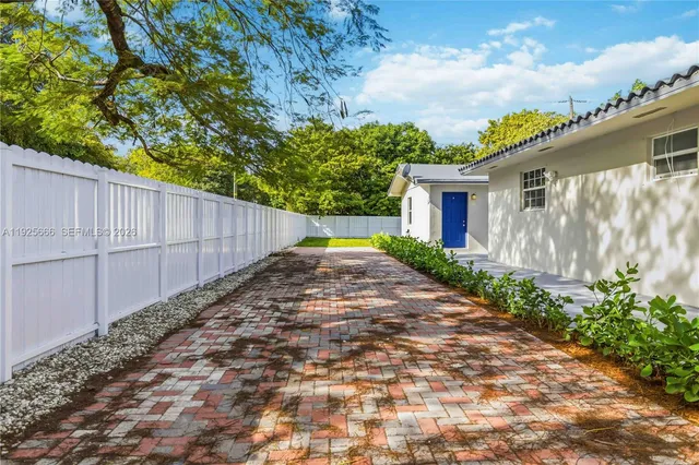 a view of a backyard with plants