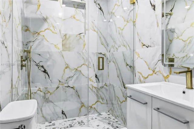 a bathroom with a sink and toilet