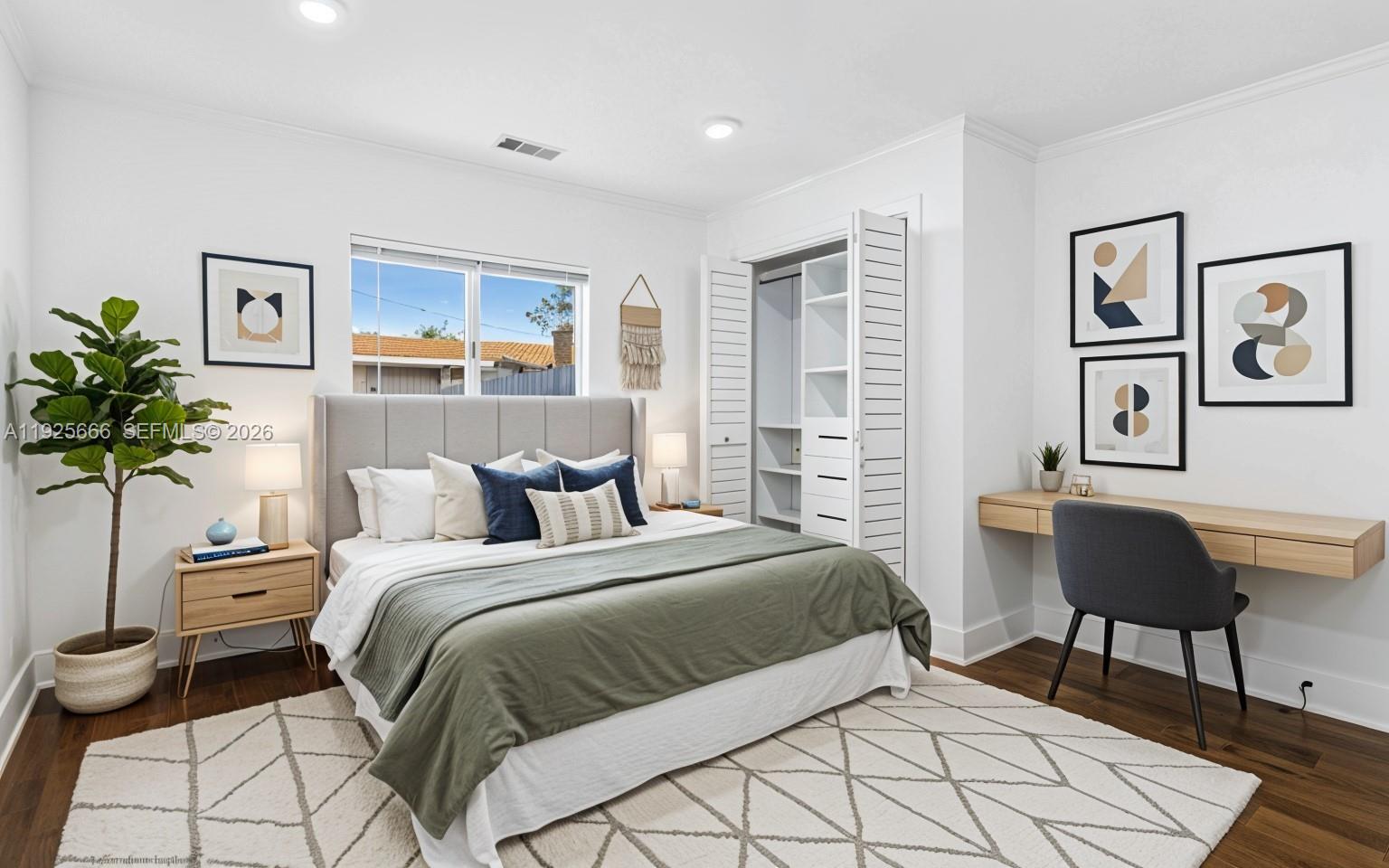 3240 Southwest 69th Avenue, Unit 2 Miami, FL 33155 - Photo 7 of 26 a bedroom with a bed and a painting on the wall