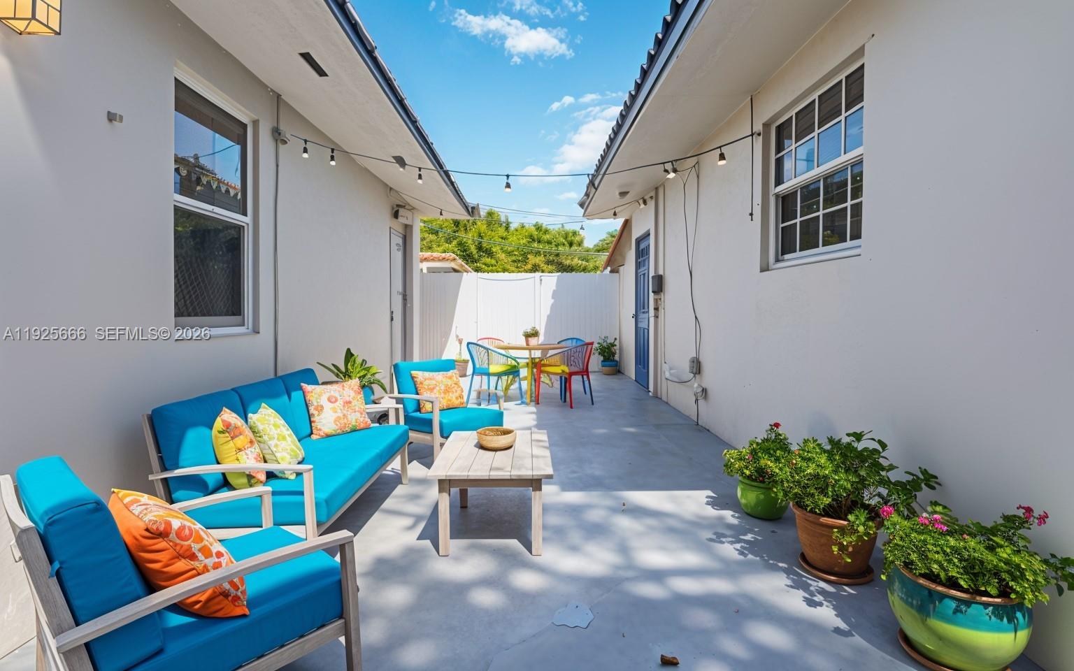 3240 Southwest 69th Avenue, Unit 2 Miami, FL 33155 - Photo 8 of 26 a outdoor living space with furniture and flowers