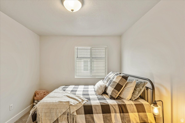 287 North 100th West Morgan, UT 84050 - Photo 21 of 27 Bedroom featuring carpet flooring and a textured ceiling