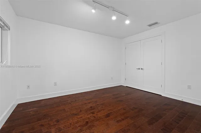 a bathroom with a shower and toilet