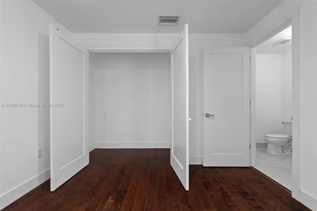 a view of an empty room with stairs