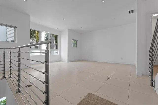 a bathroom with a sink mirror and toilet