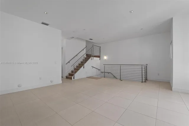 a kitchen with stainless steel appliances a sink stove and cabinets