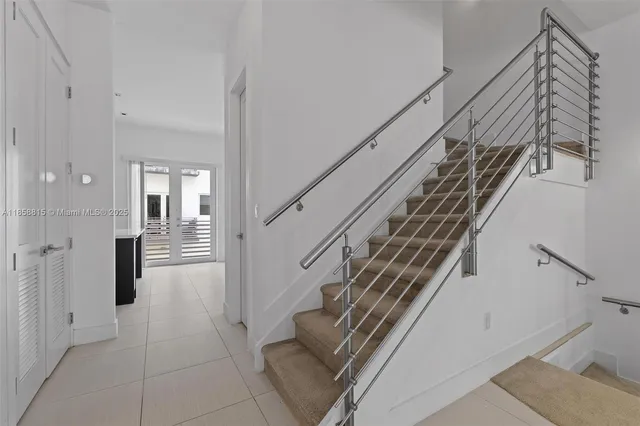 a kitchen with stainless steel appliances a refrigerator and a sink