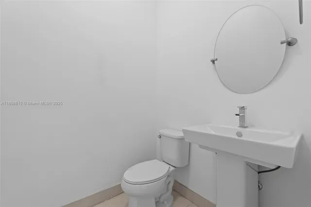 a kitchen with stainless steel appliances a sink and a refrigerator