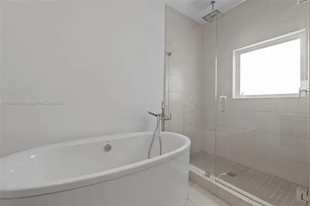 a view of a room with wooden floor and white walls