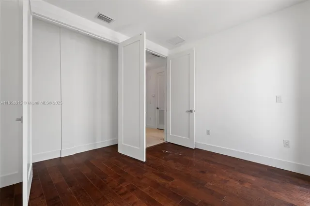 a view of a living room and a balcony