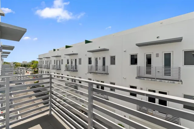 a view of a bedroom with a bed and cabinet