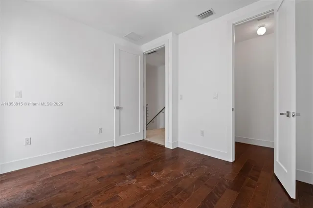 a view of a kitchen with a sink and cabinets