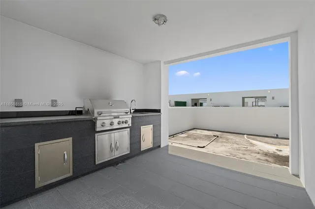 a kitchen with a stove and a refrigerator