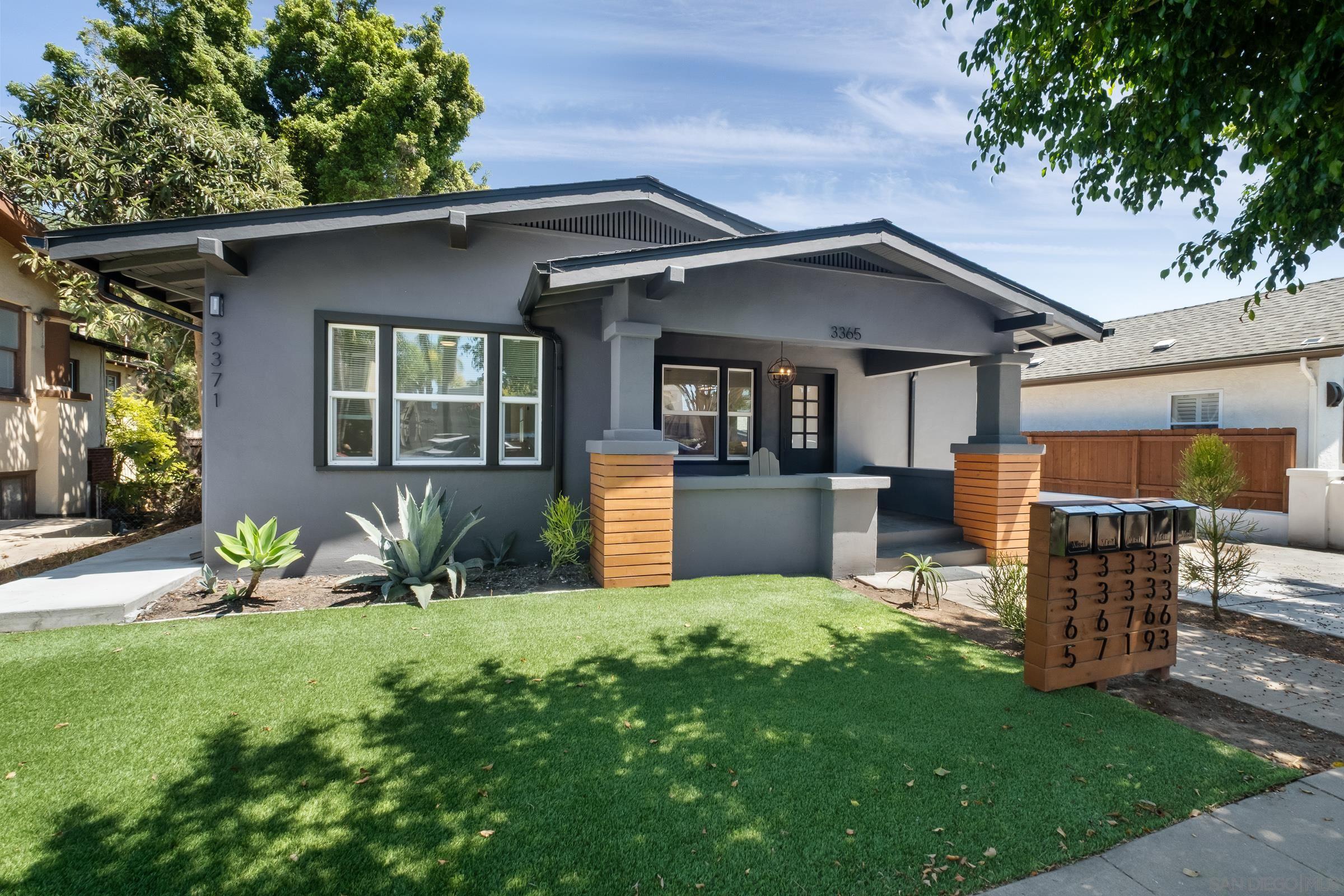 3365 Grim Avenue San Diego, CA 92104 - Photo 1 of 47 a front view of a house with garden