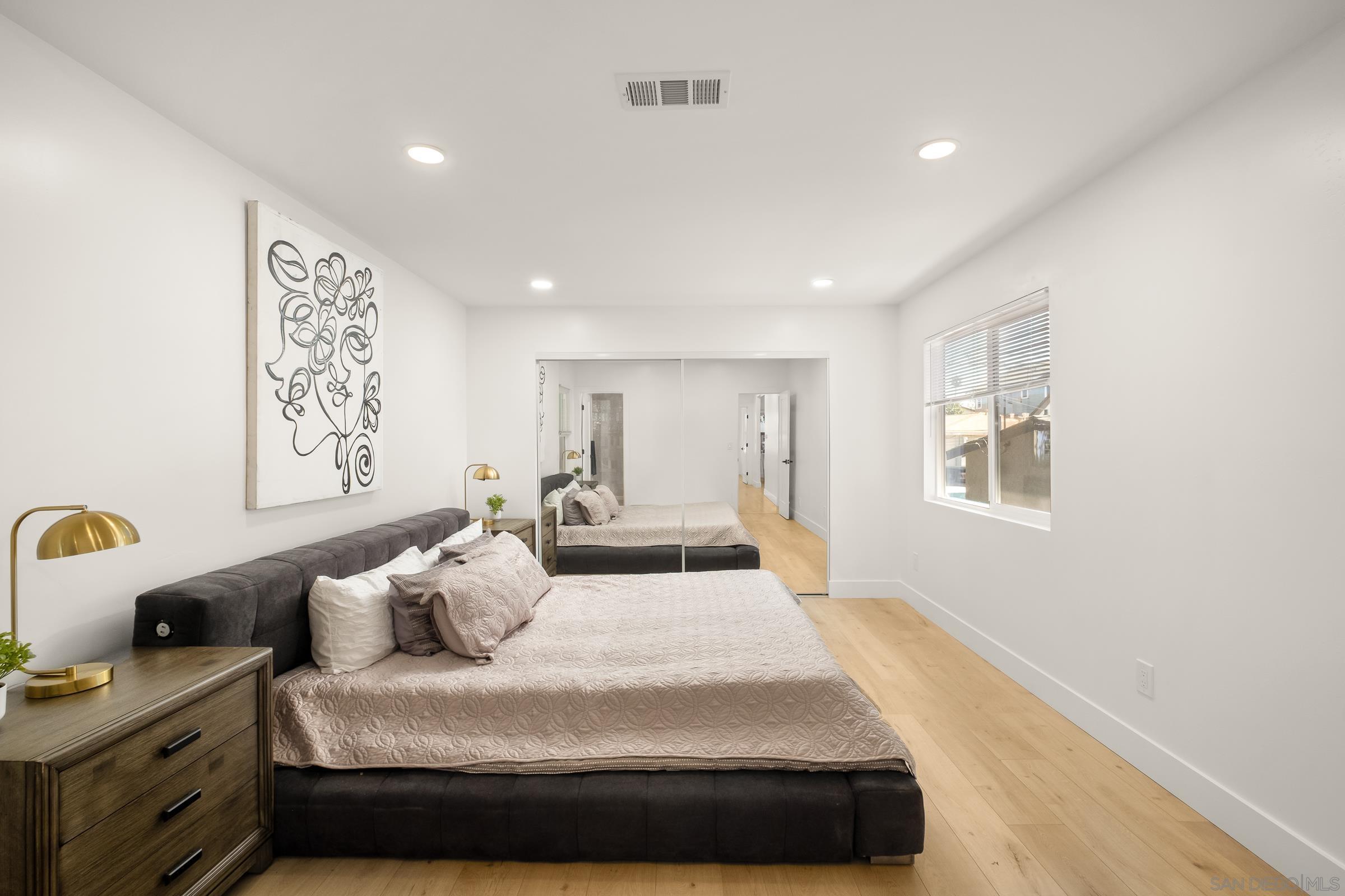 3365 Grim Avenue San Diego, CA 92104 - Photo 19 of 47 a bedroom with a large bed and a window