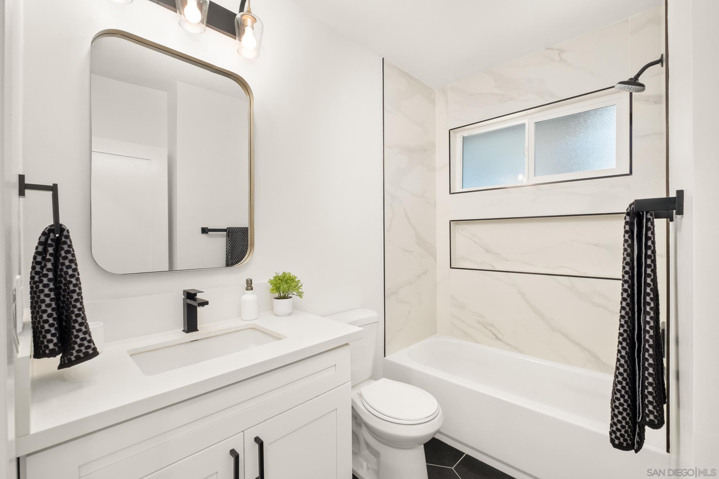 3365 Grim Avenue San Diego, CA 92104 - Photo 25 of 47 a bathroom with a sink toilet and shower