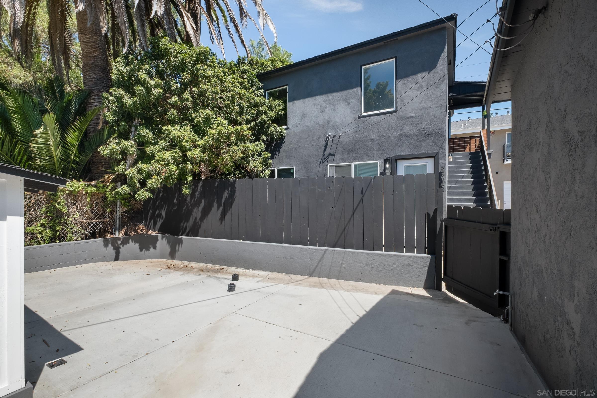 3365 Grim Avenue San Diego, CA 92104 - Photo 32 of 47 a backyard of a house with table and chairs
