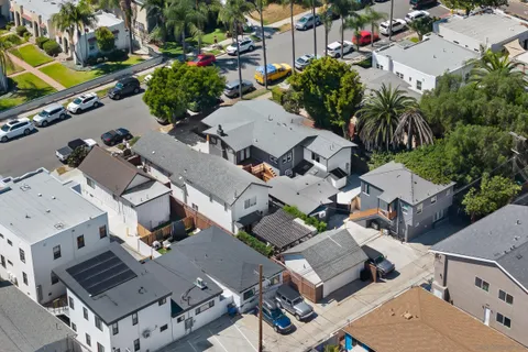 an aerial view of a city with lots of residential buildings