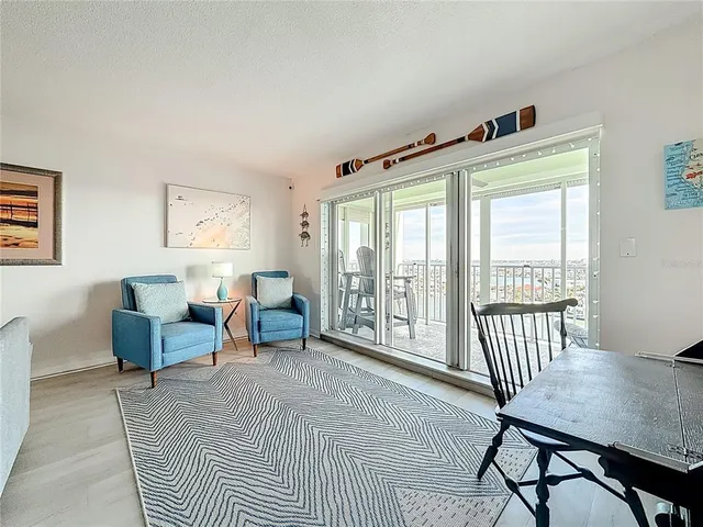 a view of a livingroom with furniture and a table