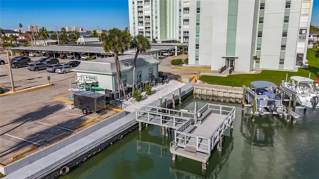 an aerial view of a house with a ocean view