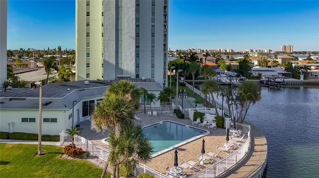 a view of a swimming pool with an outdoor seating
