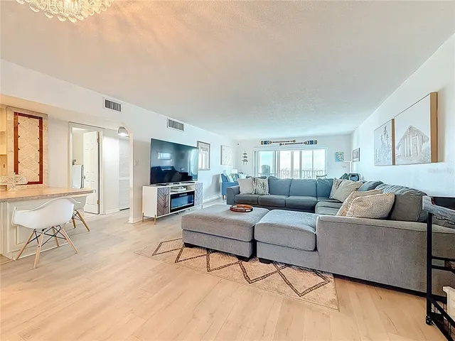 a living room with furniture and a table