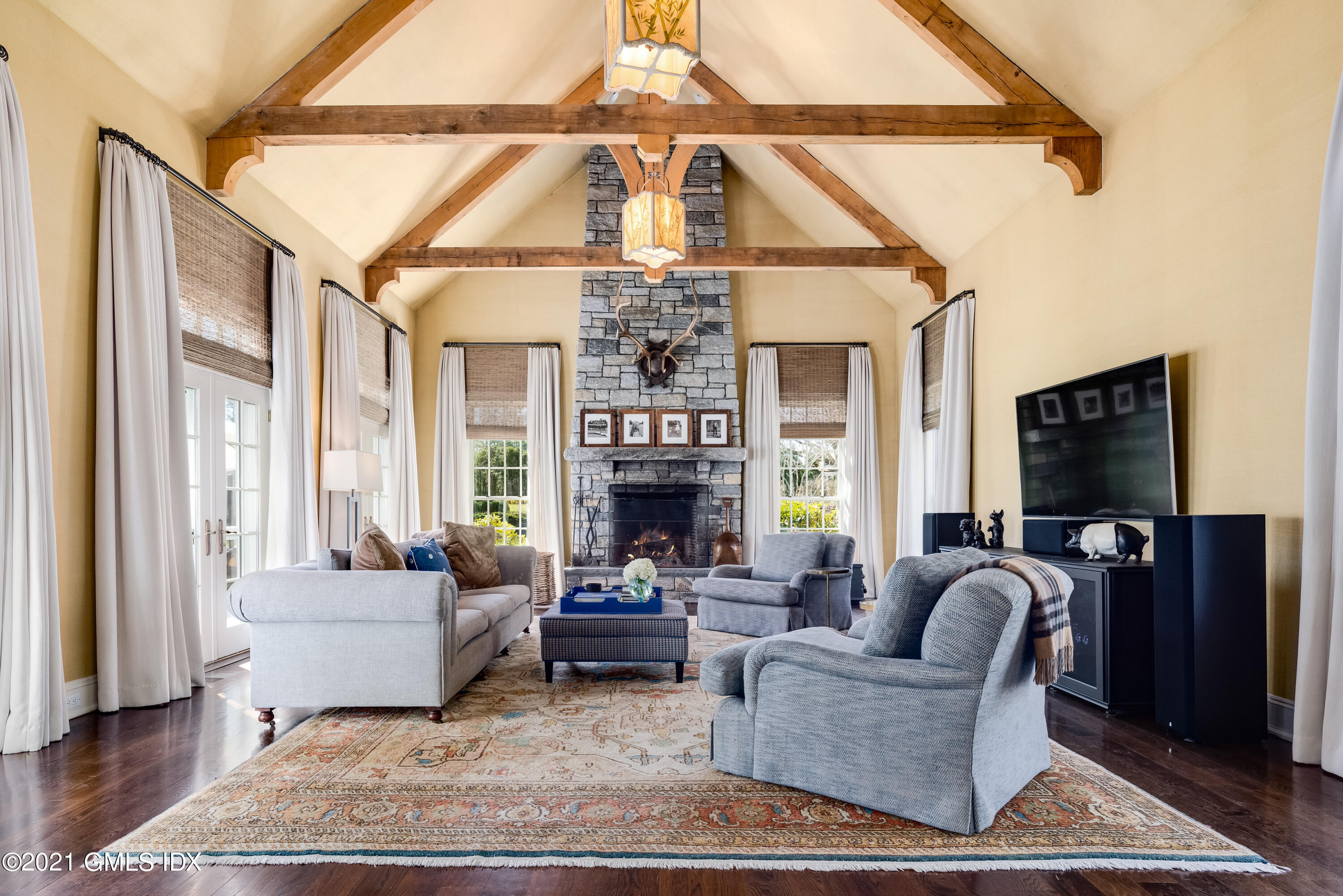 94 Doubling Road Greenwich, CT 06830 - Photo 12 of 26 a living room with fireplace furniture and a floor to ceiling window