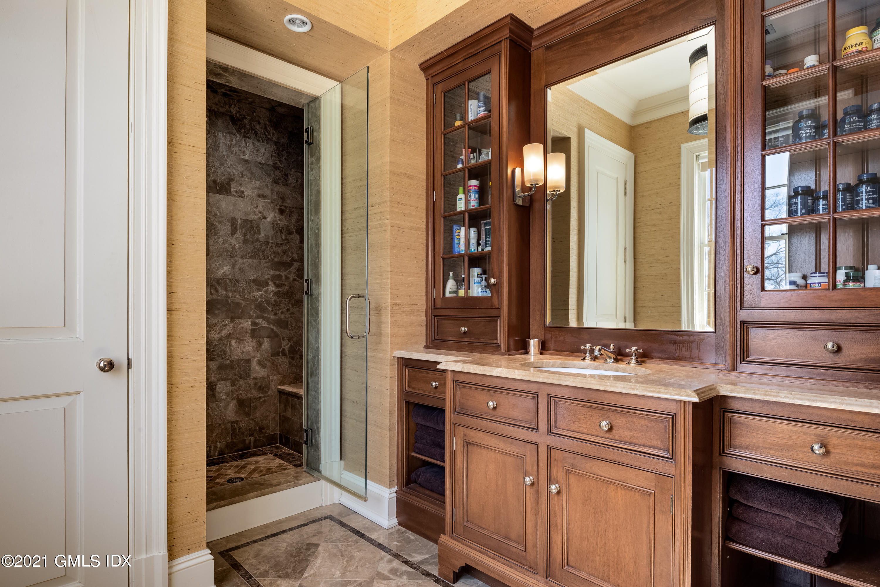 94 Doubling Road Greenwich, CT 06830 - Photo 16 of 26 a bathroom with a sink and a mirror