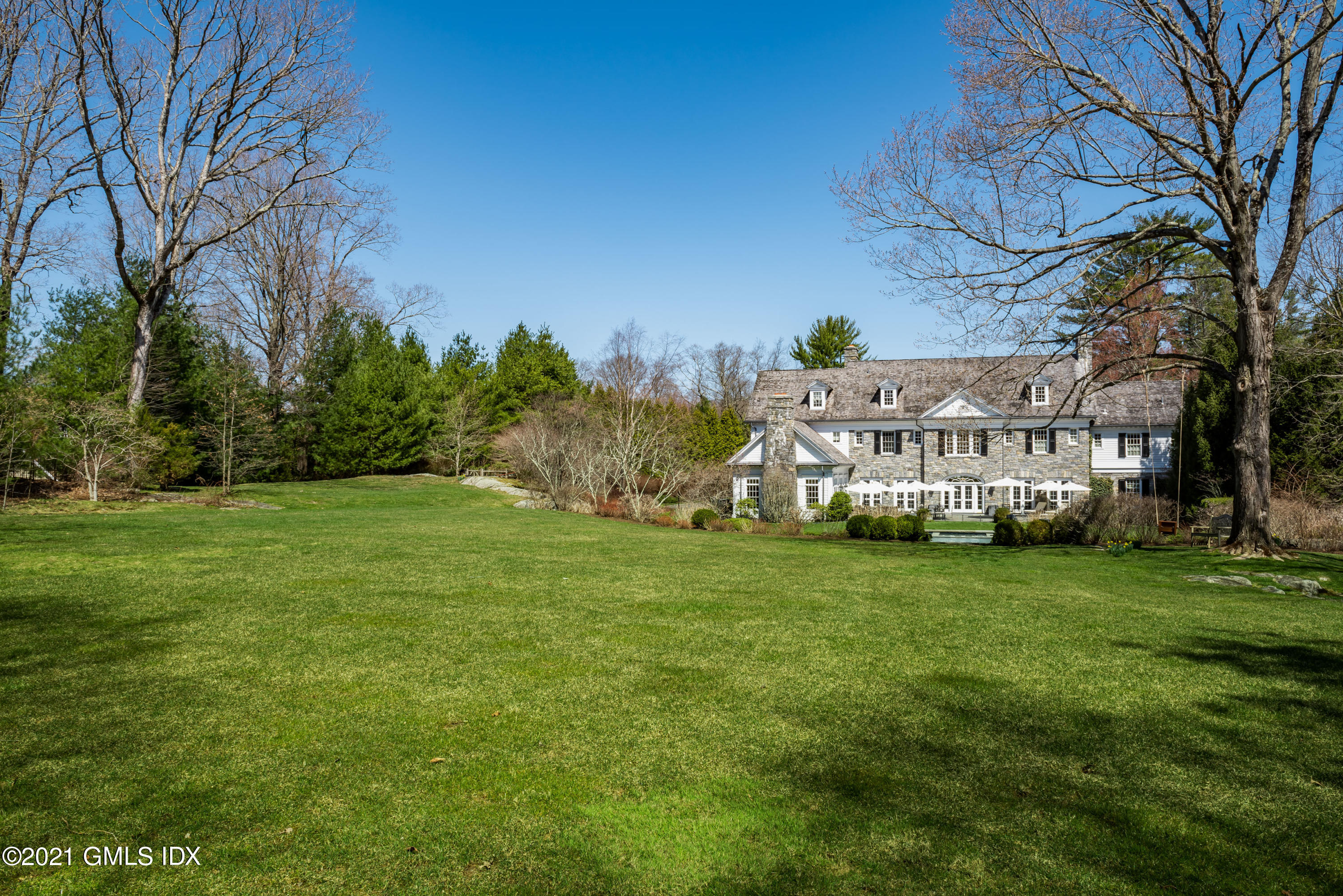 94 Doubling Road Greenwich, CT 06830 - Photo 23 of 26 a view of house with a big yard