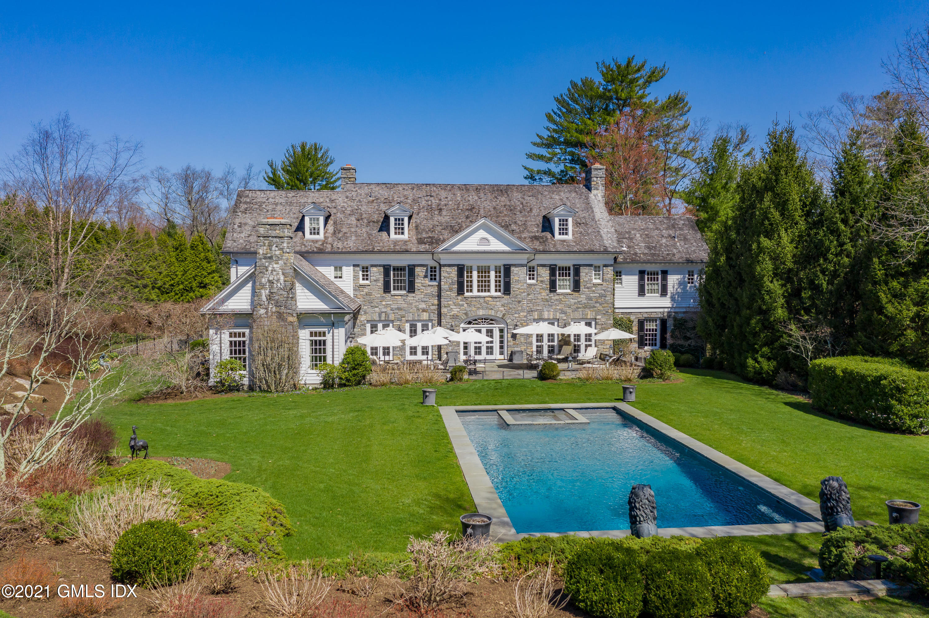 94 Doubling Road Greenwich, CT 06830 - Photo 3 of 26 a view of a house with a big yard