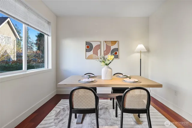 a dining room with furniture and window