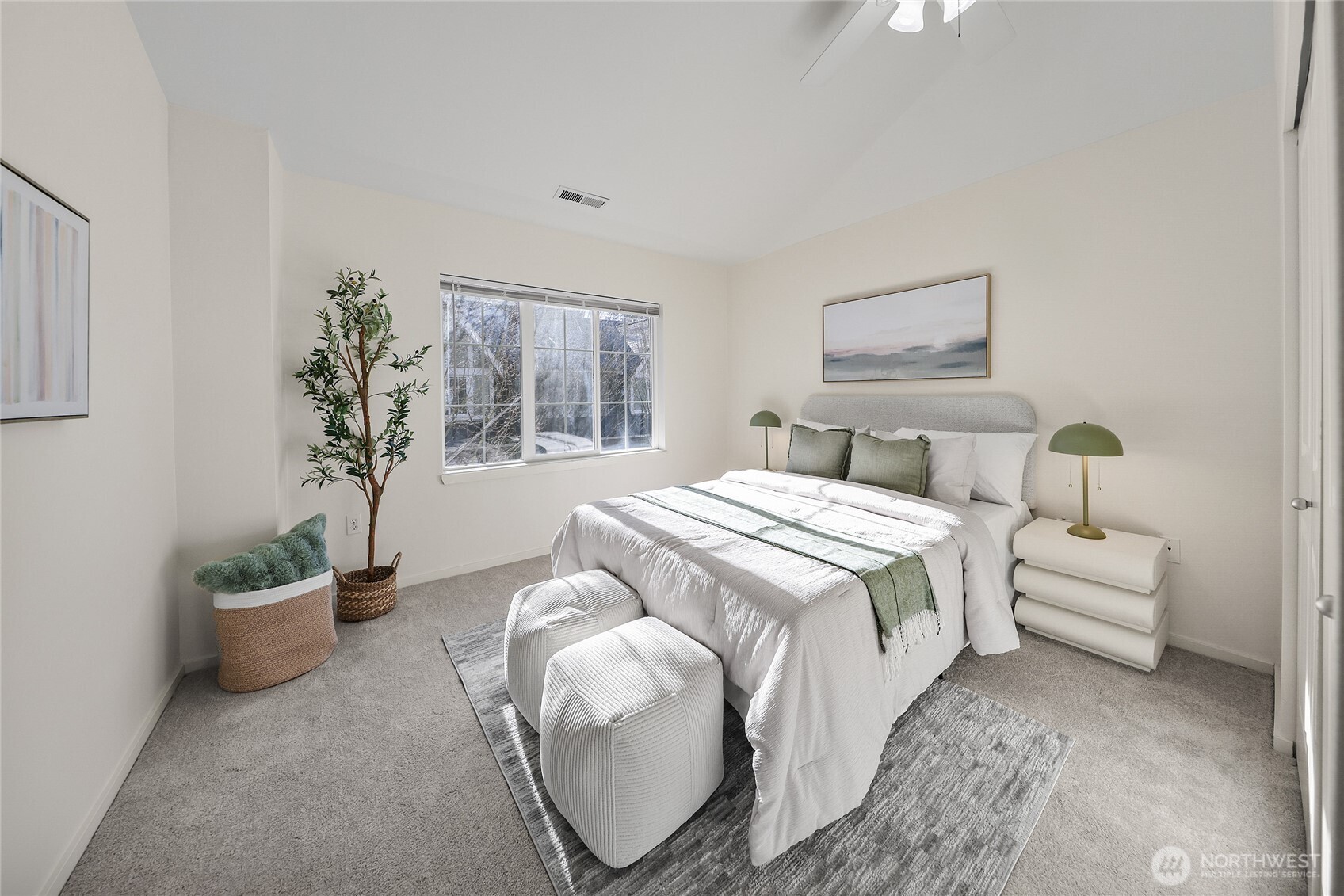 18258 Northeast 96th Way, Unit 101 Redmond, WA 98052 - Photo 17 of 36 a bedroom with bed and a potted plant