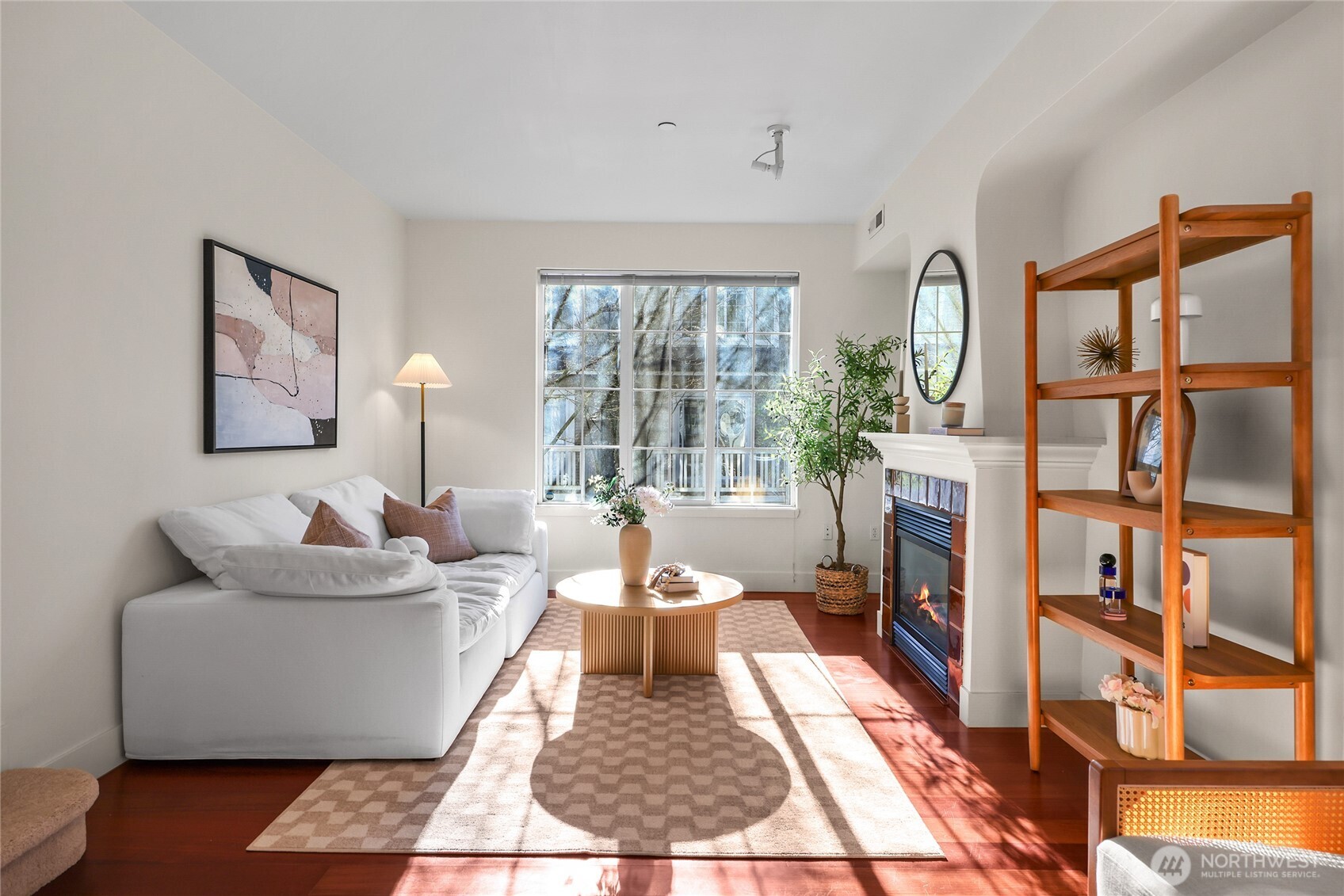 18258 Northeast 96th Way, Unit 101 Redmond, WA 98052 - Photo 2 of 36 a living room with furniture and a rug