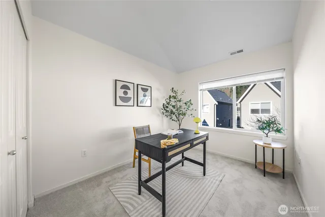 a workspace with furniture and a window