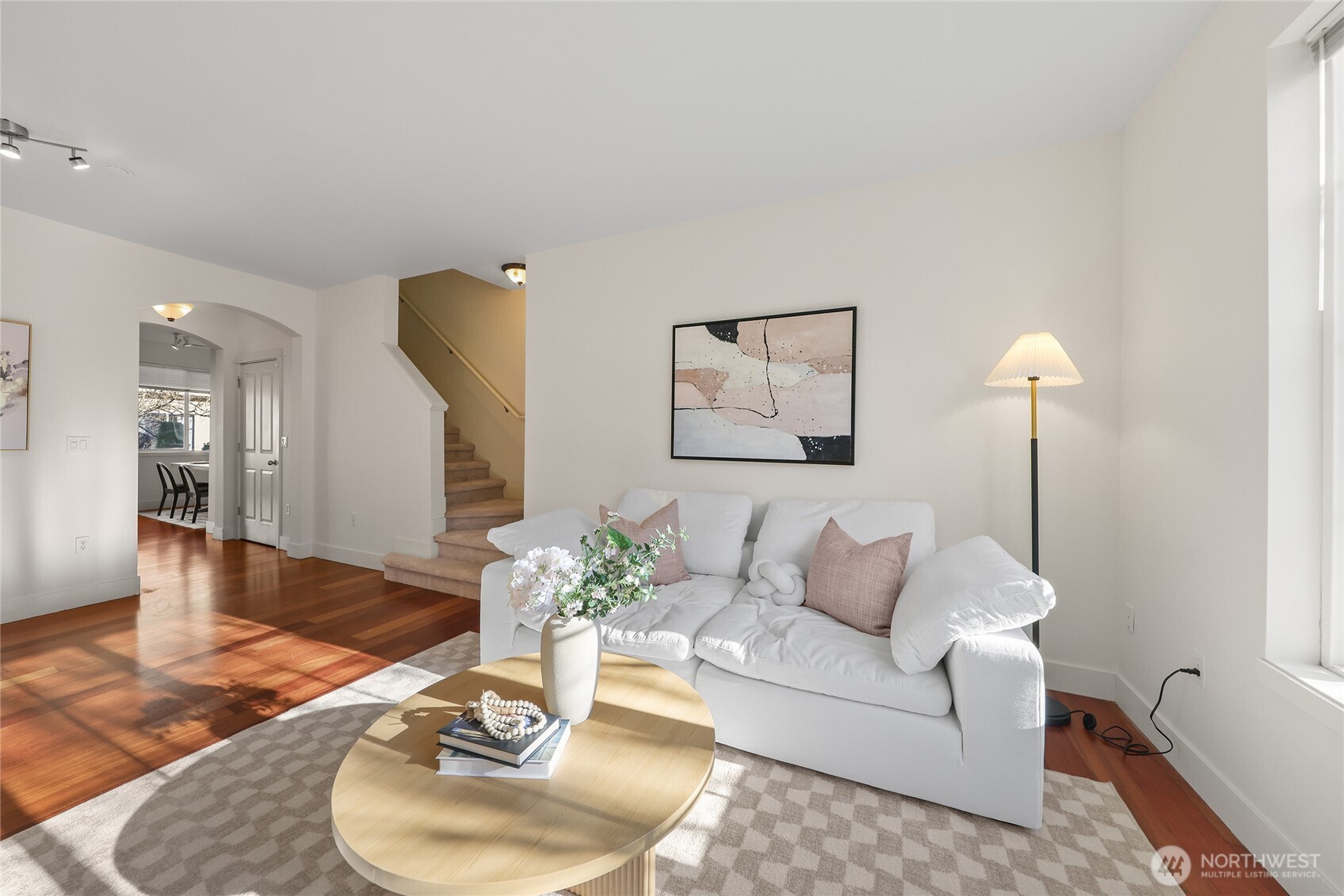 18258 Northeast 96th Way, Unit 101 Redmond, WA 98052 - Photo 3 of 36 a living room with furniture and a wooden floor