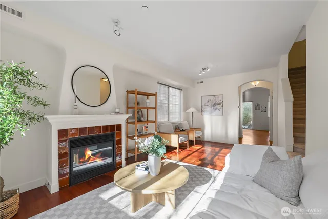 a living room with furniture a window and a fireplace