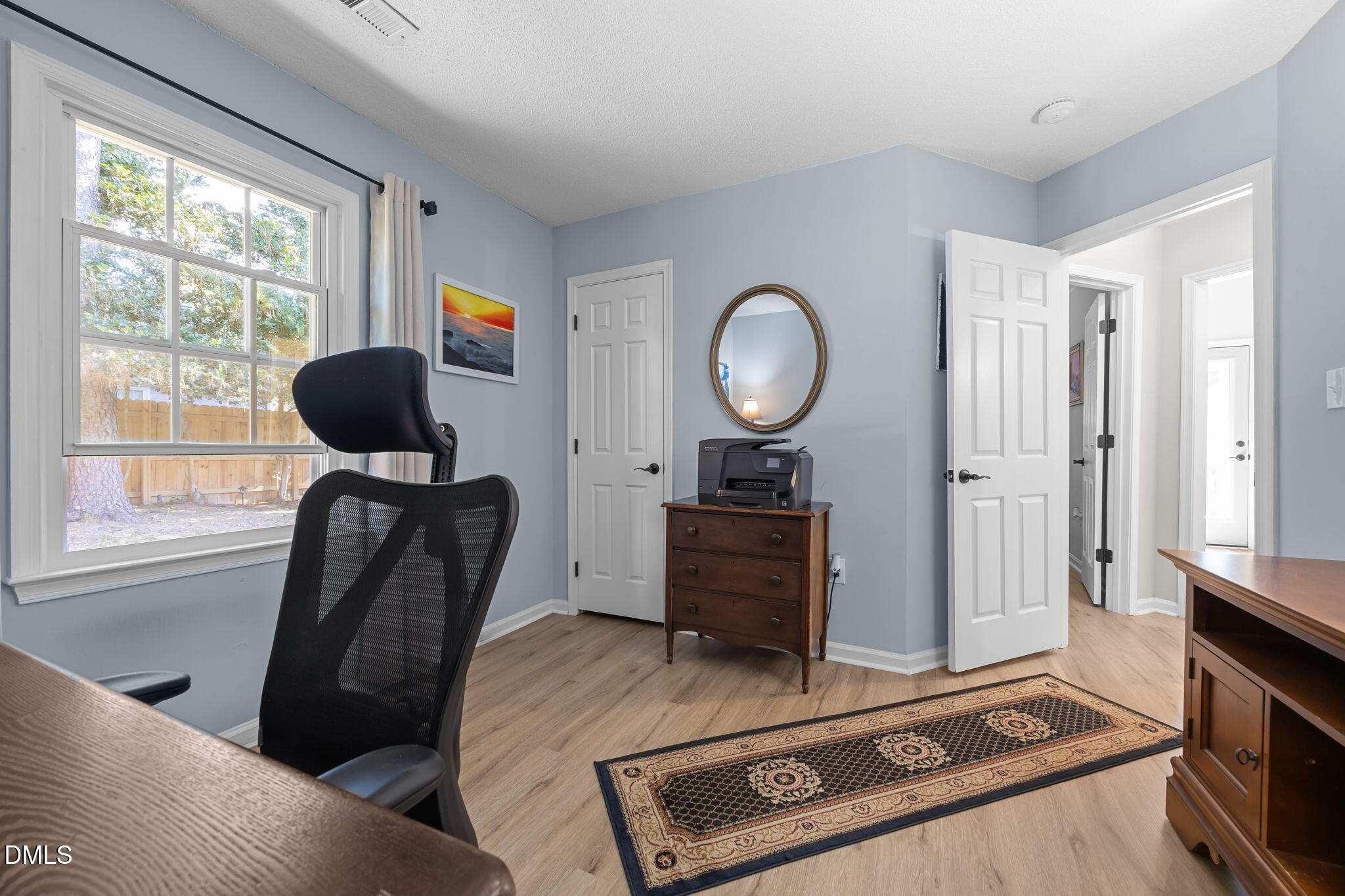 2716 Fernhurst Lane Raleigh, NC 27604 - Photo 19 of 37 a living room with furniture and a window
